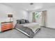 Cozy bedroom with a large bed, and a three-drawer dresser with a light fixture at 3189 Montecito Dr, Las Vegas, NV 89120