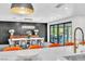 Beautiful open floorplan with dining area featuring designer lighting and backyard views at 3189 Montecito Dr, Las Vegas, NV 89120