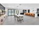 Dining room with modern light fixture, stylish decor, and open floor plan to the kitchen at 3189 Montecito Dr, Las Vegas, NV 89120