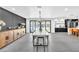 Elegant dining room with modern light fixture, stylish decor, and open floor plan at 3189 Montecito Dr, Las Vegas, NV 89120