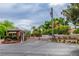 Gated entrance to Sierra Vista Ranchos with mature landscaping, guard house and brick columns at 3189 Montecito Dr, Las Vegas, NV 89120