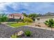 Well-maintained front yard with landscaping and gravel pathway leading to the house at 3189 Montecito Dr, Las Vegas, NV 89120