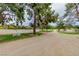 Scenic view of a horse property with fenced enclosures and gravel drive at 3189 Montecito Dr, Las Vegas, NV 89120
