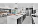 Open-concept kitchen and dining area with island seating and a view of the pool at 3189 Montecito Dr, Las Vegas, NV 89120