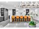 Open kitchen with modern features, stylish bar seating, and contemporary lighting at 3189 Montecito Dr, Las Vegas, NV 89120