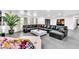 Spacious living room featuring a large leather sectional, statement fireplace and modern decor at 3189 Montecito Dr, Las Vegas, NV 89120