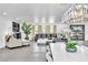 Spacious living room featuring a large leather sectional, statement fireplace and modern decor at 3189 Montecito Dr, Las Vegas, NV 89120
