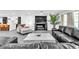 Bright and airy living room featuring a sleek fireplace, stylish furniture, and open floor plan at 3189 Montecito Dr, Las Vegas, NV 89120