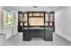 Stylish home office with custom built-in cabinets, shelving, and a large desk at 3189 Montecito Dr, Las Vegas, NV 89120