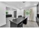 Spacious home office with a large desk, plenty of natural light, and modern decor at 3189 Montecito Dr, Las Vegas, NV 89120