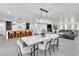 Open floor plan featuring the dining room, living room, and kitchen with barstool seating at 3189 Montecito Dr, Las Vegas, NV 89120