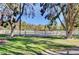 Large grassy horse pasture with mature shade trees and white fencing at 3189 Montecito Dr, Las Vegas, NV 89120