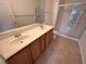 Features dual sinks, spacious countertop, and a glass-enclosed shower for convenience at 3354 Indian Shadow St # 203, Las Vegas, NV 89129