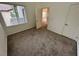Bedroom featuring neutral carpeting, natural light, and ample space at 3354 Indian Shadow St # 203, Las Vegas, NV 89129