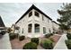 A building exterior showcases a well-maintained corner unit with a view of the covered parking at 3354 Indian Shadow St # 203, Las Vegas, NV 89129