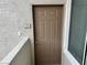 The front door features a secure lock and is protected by a modern screen at 3354 Indian Shadow St # 203, Las Vegas, NV 89129