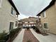 Exterior view showcasing a driveway flanked by two buildings, with a mountain backdrop at 3354 Indian Shadow St # 203, Las Vegas, NV 89129