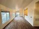 A well lit living room with access to an outdoor patio, and an entrance to other rooms at 3354 Indian Shadow St # 203, Las Vegas, NV 89129