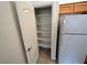 A well-organized pantry with multiple shelves provides ample storage in the kitchen area at 3354 Indian Shadow St # 203, Las Vegas, NV 89129