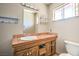 Bathroom with a single sink, tile countertop, and a mirror at 3434 Toquima Cir, Las Vegas, NV 89120