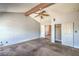 Spacious bedroom featuring a ceiling fan, exposed beam, and a double-door closet at 3434 Toquima Cir, Las Vegas, NV 89120