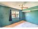 Bedroom with a ceiling fan, carpet, closet, and a window with views of the street at 3434 Toquima Cir, Las Vegas, NV 89120