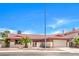 Charming single-story home featuring a tile roof, palm trees, and an attached two-car garage at 3434 Toquima Cir, Las Vegas, NV 89120