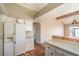 Bright kitchen connected to the living area, featuring white cabinets and essential appliances at 3434 Toquima Cir, Las Vegas, NV 89120