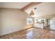 Open living area featuring beamed ceilings, tile flooring, and a view into the kitchen at 3434 Toquima Cir, Las Vegas, NV 89120