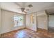 Bright living room featuring tile floors, a ceiling fan, and natural light at 3434 Toquima Cir, Las Vegas, NV 89120