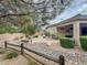 Expansive backyard featuring a fire pit, lush landscaping, and a covered patio, perfect for outdoor living at 3476 Ridge Meadow St, Las Vegas, NV 89135