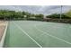 Full basketball court featuring a green surface, white lines, and basketball hoop in a community park at 3476 Ridge Meadow St, Las Vegas, NV 89135