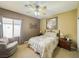 Cozy bedroom with a comfortable armchair and plenty of natural light at 3476 Ridge Meadow St, Las Vegas, NV 89135