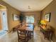Inviting dining room featuring a large wooden table and neutral tones at 3476 Ridge Meadow St, Las Vegas, NV 89135