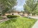 Beautiful home exterior with a well-manicured lawn, mature trees, and inviting curb appeal in a desirable neighborhood at 3476 Ridge Meadow St, Las Vegas, NV 89135