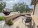 Cozy front porch with flagstone and outdoor seating perfect for relaxing and enjoying the neighborhood view at 3476 Ridge Meadow St, Las Vegas, NV 89135