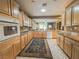 Bright kitchen featuring wooden cabinets and a seamless layout into the living areas at 3476 Ridge Meadow St, Las Vegas, NV 89135