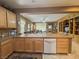 Well-lit kitchen with views into the great room, and breakfast bar at 3476 Ridge Meadow St, Las Vegas, NV 89135