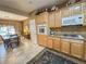Charming kitchen with wooden cabinets, granite countertops, and stainless steel appliances at 3476 Ridge Meadow St, Las Vegas, NV 89135