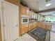Functional kitchen boasting light wood cabinetry, modern appliances, and an efficient layout at 3476 Ridge Meadow St, Las Vegas, NV 89135