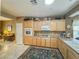 Kitchen with wood cabinets, ample counter space, and stainless steel appliances at 3476 Ridge Meadow St, Las Vegas, NV 89135