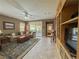 Open concept living room with sliding glass doors to patio and built-in cabinetry at 3476 Ridge Meadow St, Las Vegas, NV 89135
