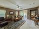 Comfortable living room with outdoor access and view into the Primary bedroom at 3476 Ridge Meadow St, Las Vegas, NV 89135