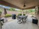 Covered patio with a dining table and chairs, perfect for outdoor entertaining and relaxation at 3476 Ridge Meadow St, Las Vegas, NV 89135