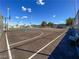Outdoor basketball court perfect for recreation, surrounded by a fence and blue skies at 3660 Haverhill St, Las Vegas, NV 89121
