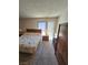 Bright bedroom with carpet and a view from the window, paired with a TV set on a wooden stand at 3660 Haverhill St, Las Vegas, NV 89121