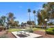 Community green space with picnic table, mature trees and a putting green at 3660 Haverhill St, Las Vegas, NV 89121