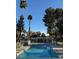Community pool offering residents a refreshing escape with mature landscaping and trees surrounding the area at 3660 Haverhill St, Las Vegas, NV 89121