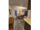 Dining area featuring neutral carpet, modern lighting, and a dining set for six at 3660 Haverhill St, Las Vegas, NV 89121