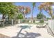 Community hot tub with lounge chairs, surrounded by a white fence and desert landscaping at 3660 Haverhill St, Las Vegas, NV 89121